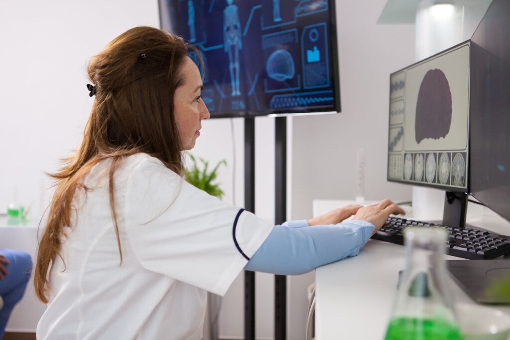 A woman scientist working on a computer