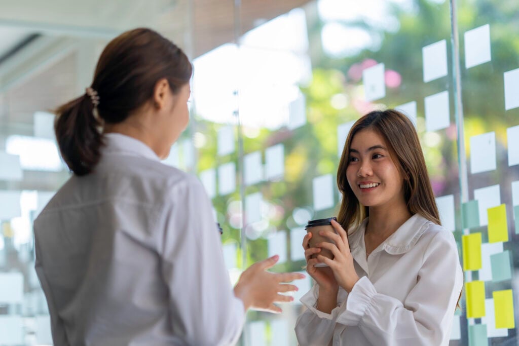 Two young professional women having a conversation