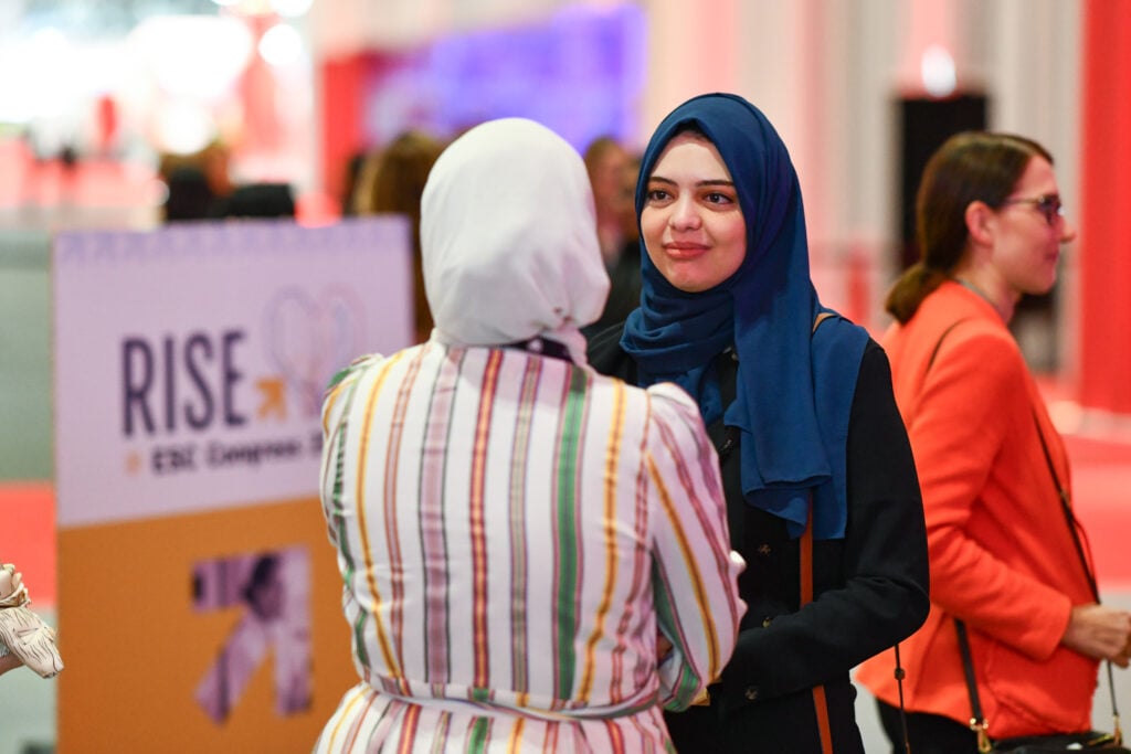 Two women physicians having a conversation at RISE @ ESC Congress