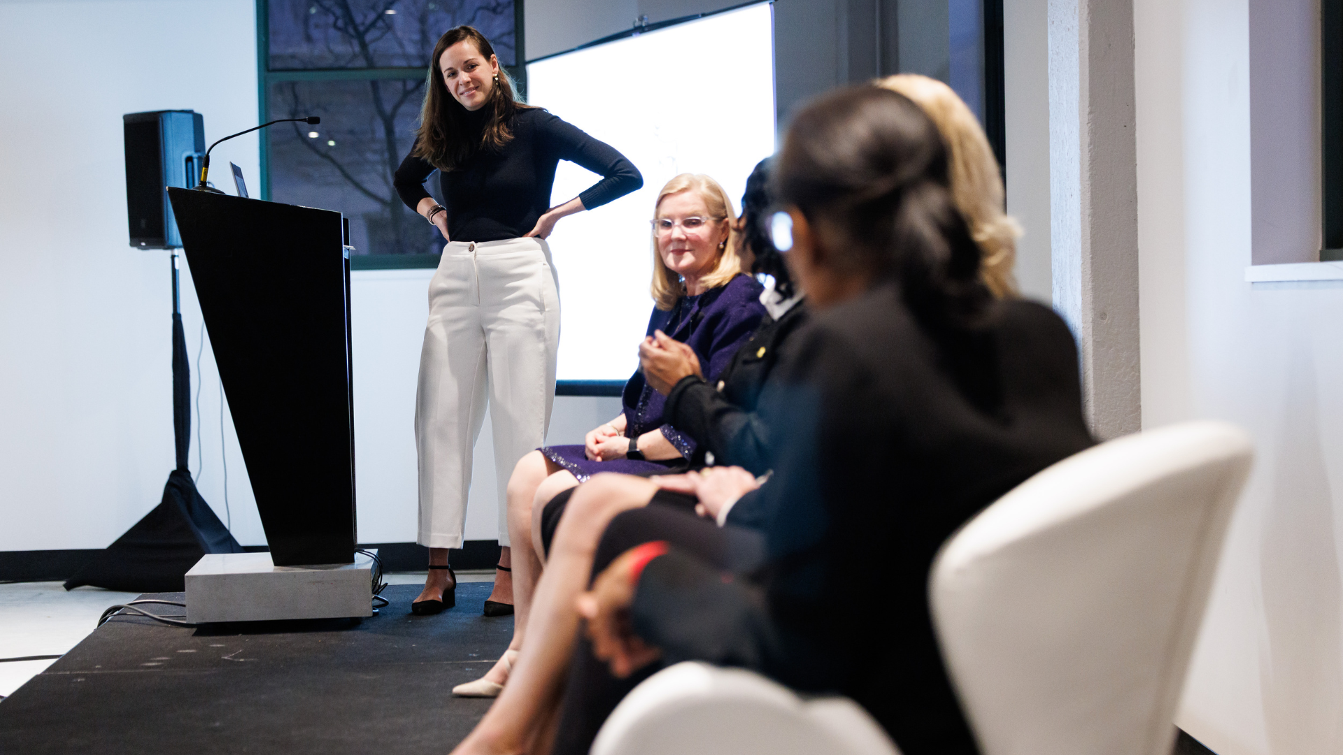 Women on a stage during a panel discussion about mentorship and sponsorship