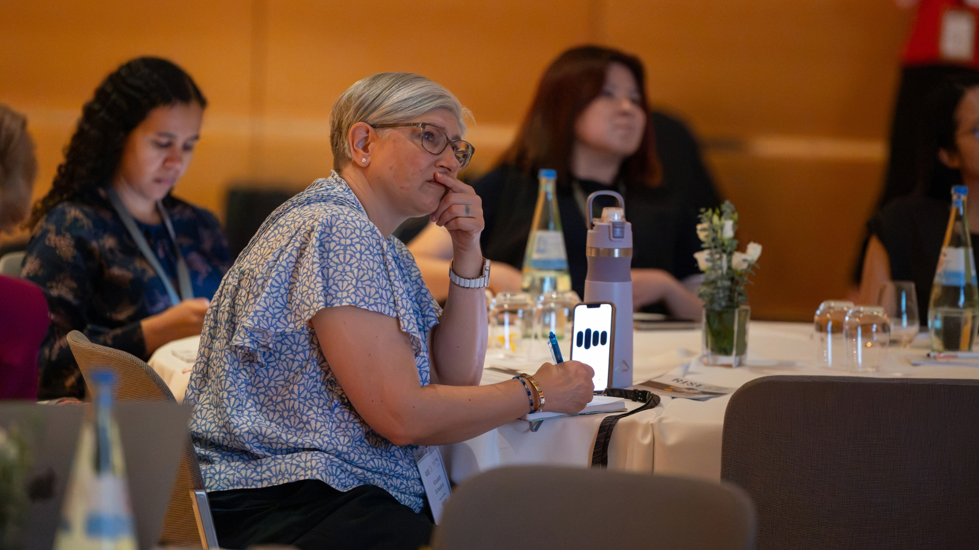 Attendee sat taking notes looking thoughtful during the quality in cardiovascular care session at RISE @ ESC Congress 2026.